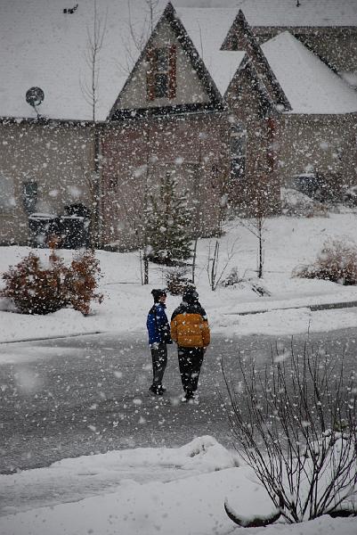 Two Deacons gathering fast offerings in the snow